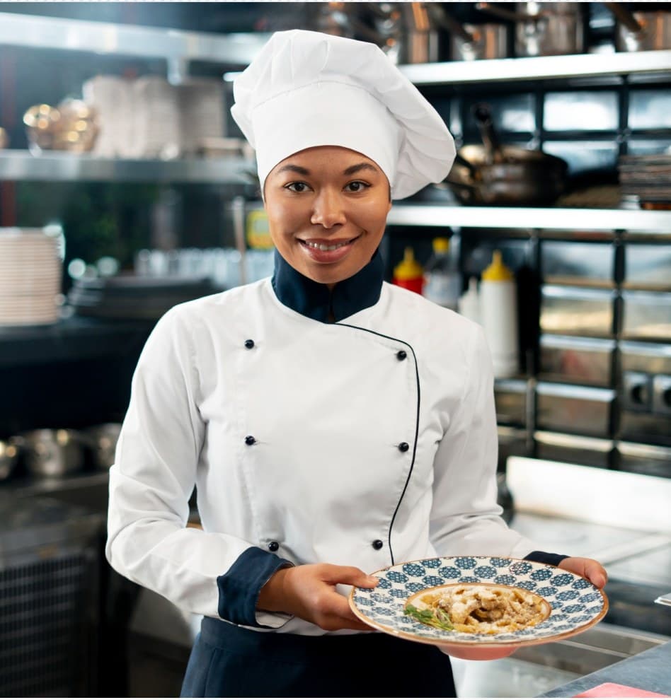Chef presenting a plated dish